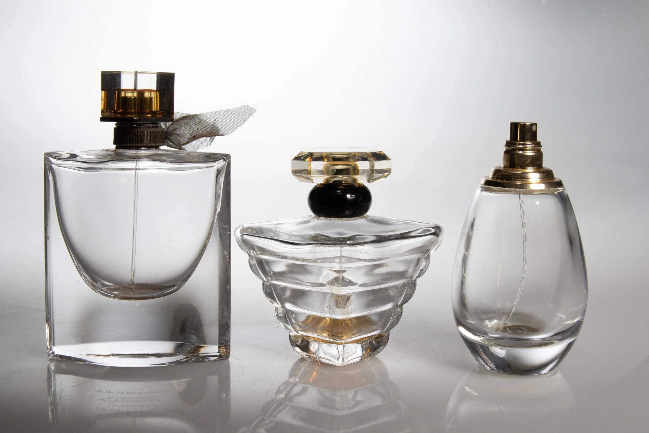 Elegant perfume bottles on a light background