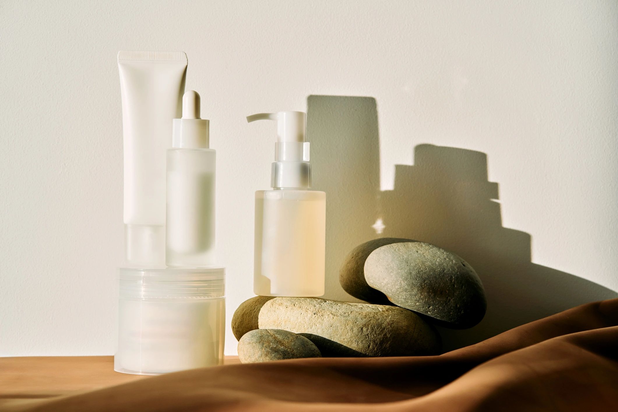 Minimalist skincare cosmetic products arranged in editorial still life